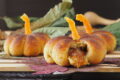 Jam-stuffed pumpkin bread rolls (pumpkin shaped)