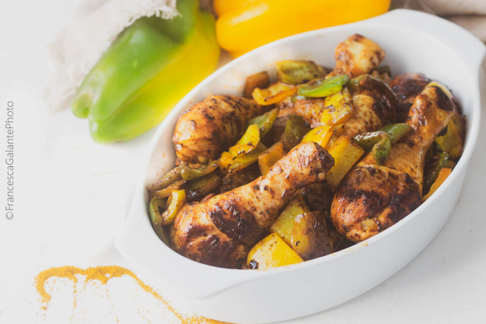 Spiced chicken with peppers in a pan