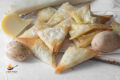Phyllo pastry triangles with cooked potatoes and cheese