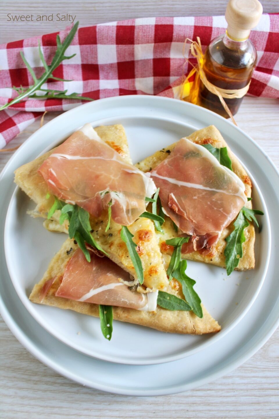 Quick focaccia with prosciutto stracchino cheese and rocket