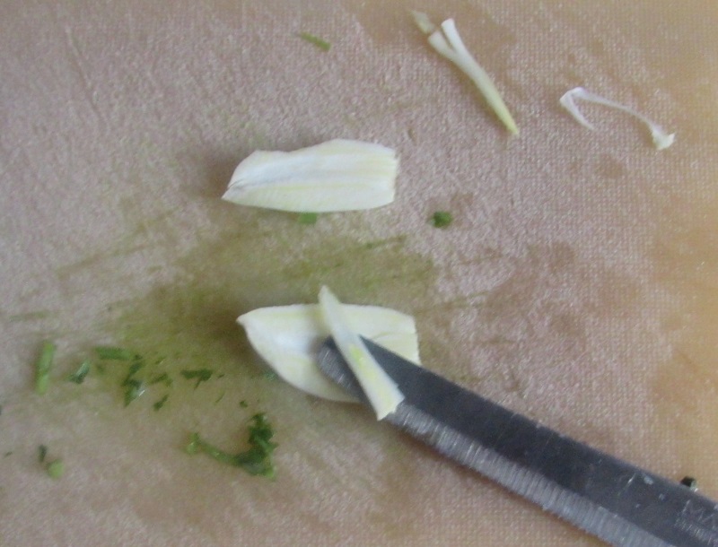 removing the heart of the garlic for the salmoriglio sauce