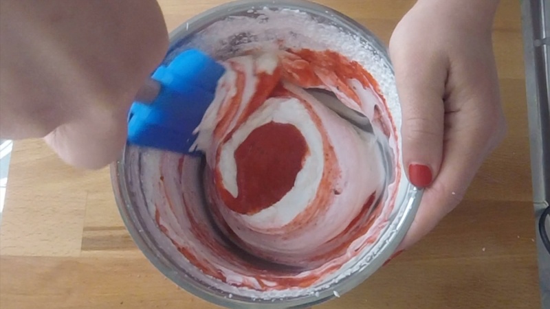add blended strawberry in whipped cream