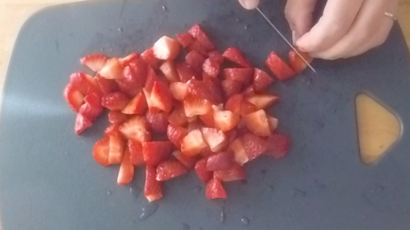 cut strawberries for the strawberry mousse cake