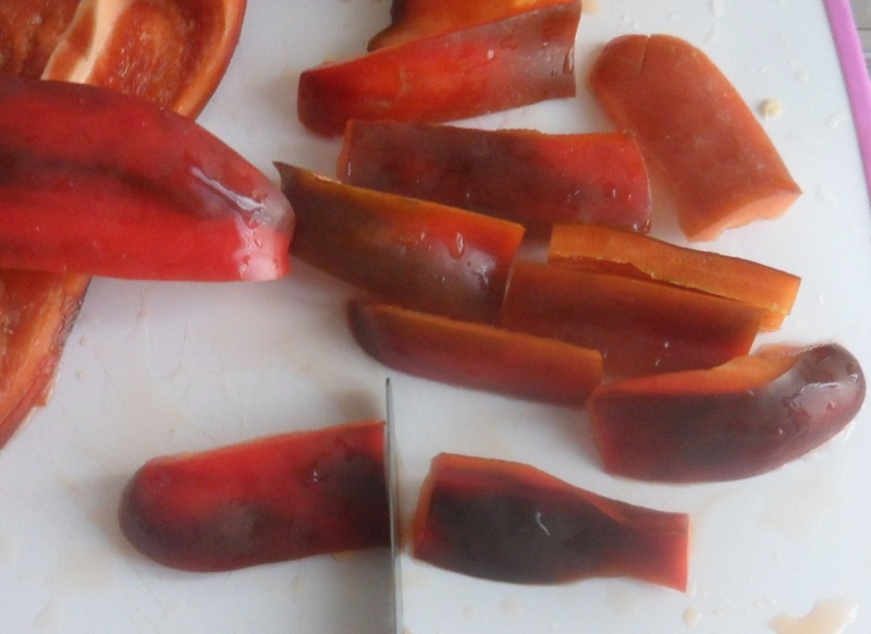 cut the bell peppers in to stripes for the italian sweet and sour peppers recipe