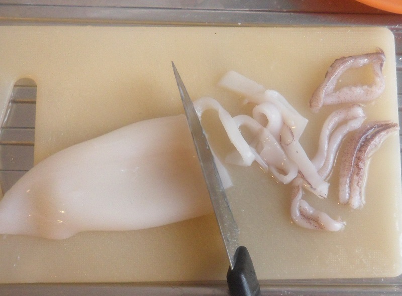 cut the squid into strips for the italian seafood pasy