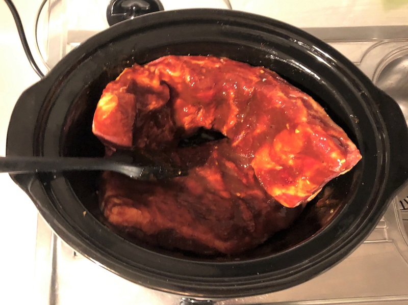 brush the ribs with the barbecue sauce for the slow cooker ribs recipe