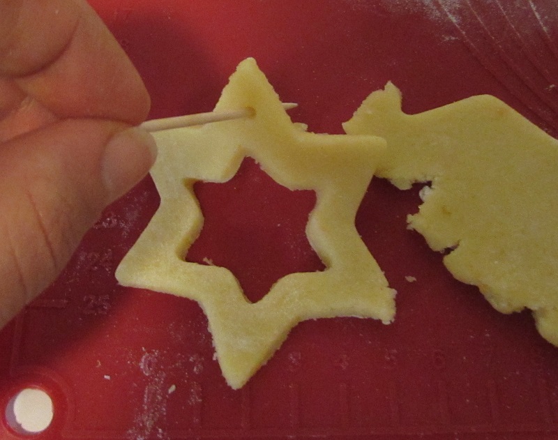 pierce the glutenfree stained glass cookies with a wooden toothpick to hang them on the Christmas tree