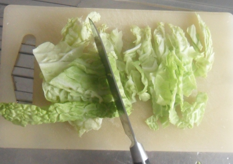 cut the savory cabbage leaves in to stripes for the cabbage and potato soup