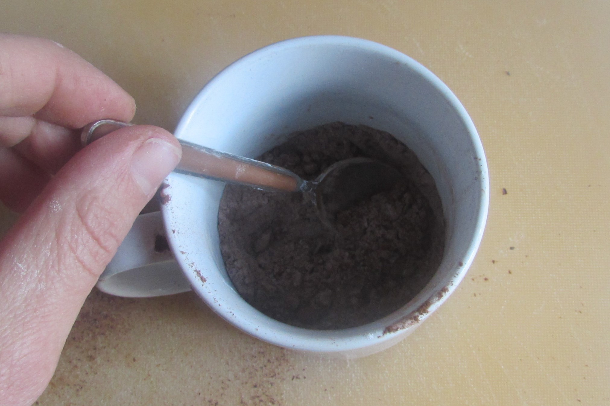 combine chocolate cocoa and sugar in the mug