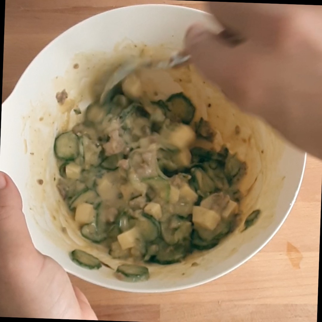prepare the filling for the zucchini and sausage savory pie