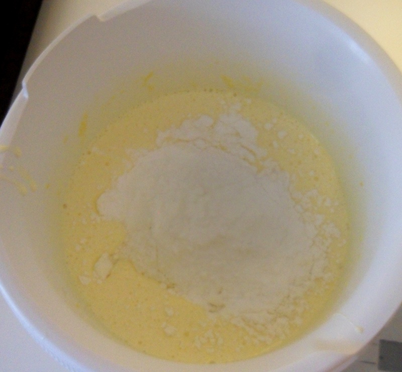 add the flour to the eggs for the Christmas cake dough