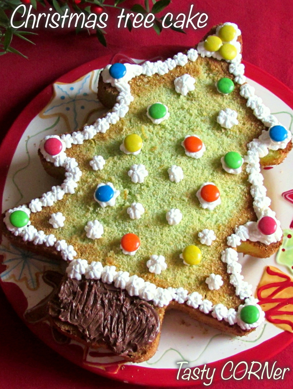 en_v_ easy christmas tree cake quick recipe sponge cake simply decorated with M&M's by tasty corner blog