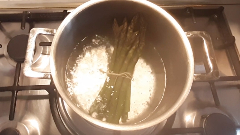 boil the asparagus after tying them
