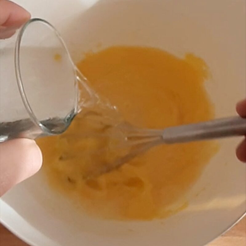 add oil to eggs and sugar while mixing