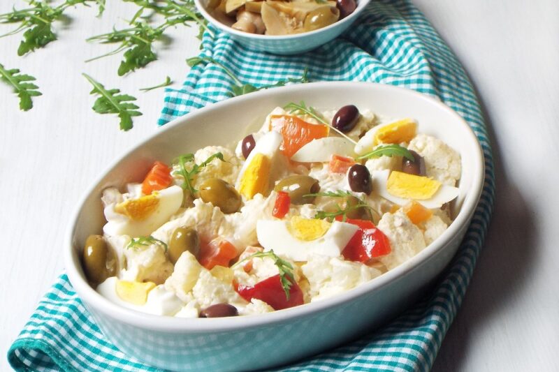 Cauliflower salad with pickles and eggs Italian style